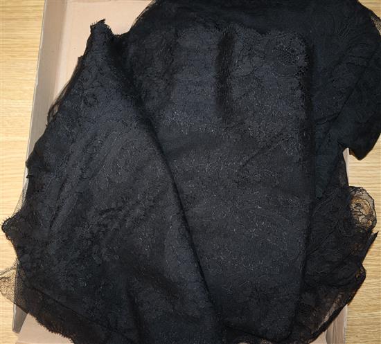 A black Chantilly lace mantilla, a lace stole, various lace bonnets, veils and a collar